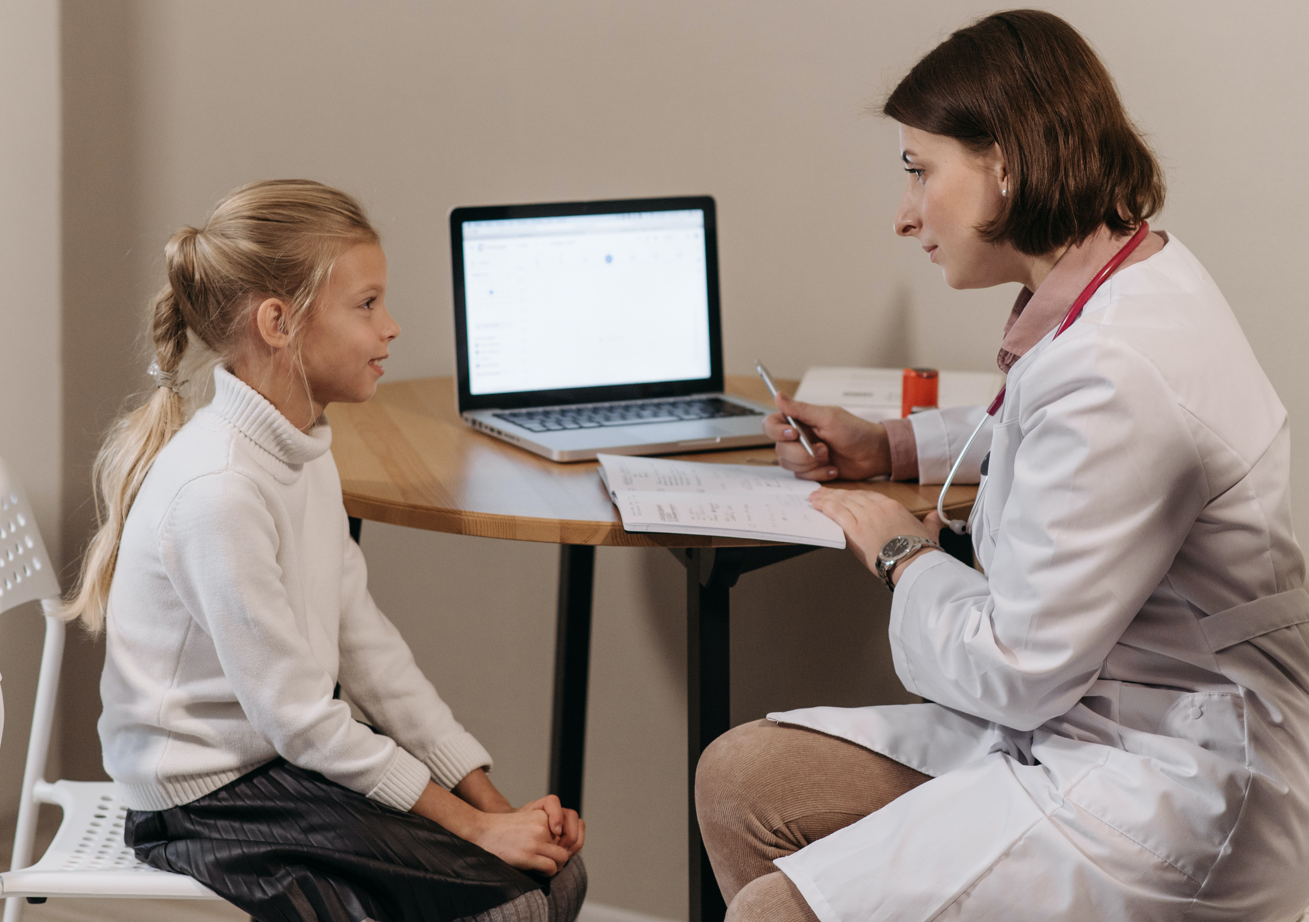 child talking with doctor